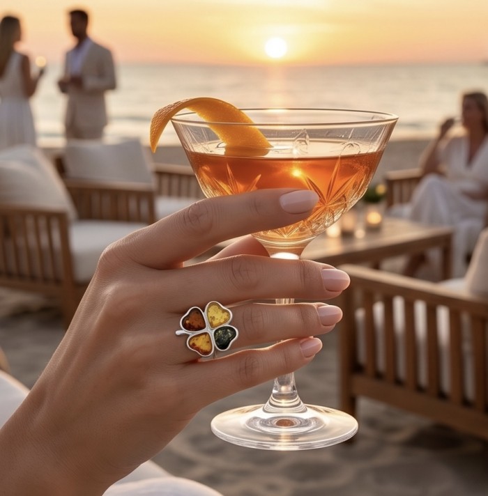 Flower Authentic Baltic Amber .925 Sterling Silver dipped in rhodium handcrafted ring; s. 8 adjustable - Worn on hand, clover Baltic Amber ring with cocktail at sunset beach.