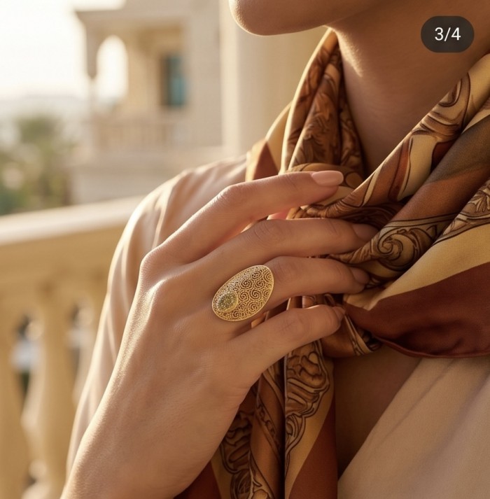 Dubai Style .925 Sterling Silver dipped in 22K Gold handmade Large ring size 8 - Gold-plated silver ring worn on hand with scarf detail in background.