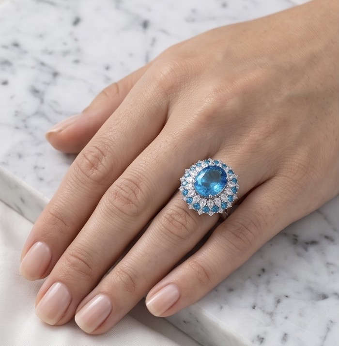 Paris Sky Blue 8.8 carat Swiss Blue Topaz .925 Sterling Silver dipped in rhodium handcrafted ring size 7 - Paris Sky Blue Topaz ring, worn on hand, marble surface background.