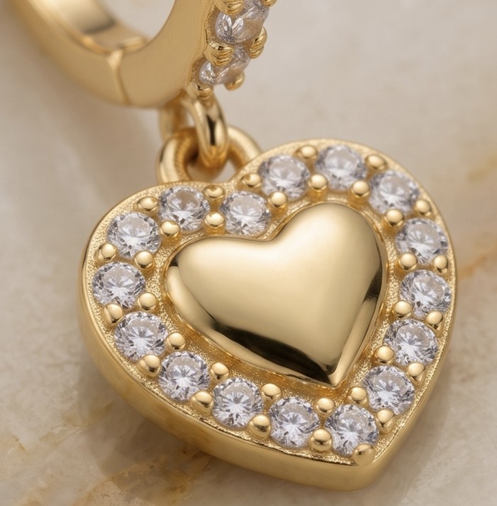 Precious Hearts - authentic 0.5 carat White Topaz .925 Sterling Silver dipped in 14K Gold handcrafted Statement Earrings - Heart charm with white topaz close-up, gold setting detail.