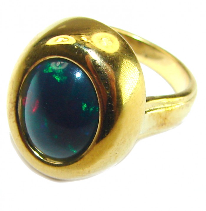 A COSMIC POWER Genuine 5.2 carat Black Opal 18K Gold over .925 Sterling Silver handmade Ring size 4 1/2 - Side view of a black opal gold ring showcasing its stone and setting.