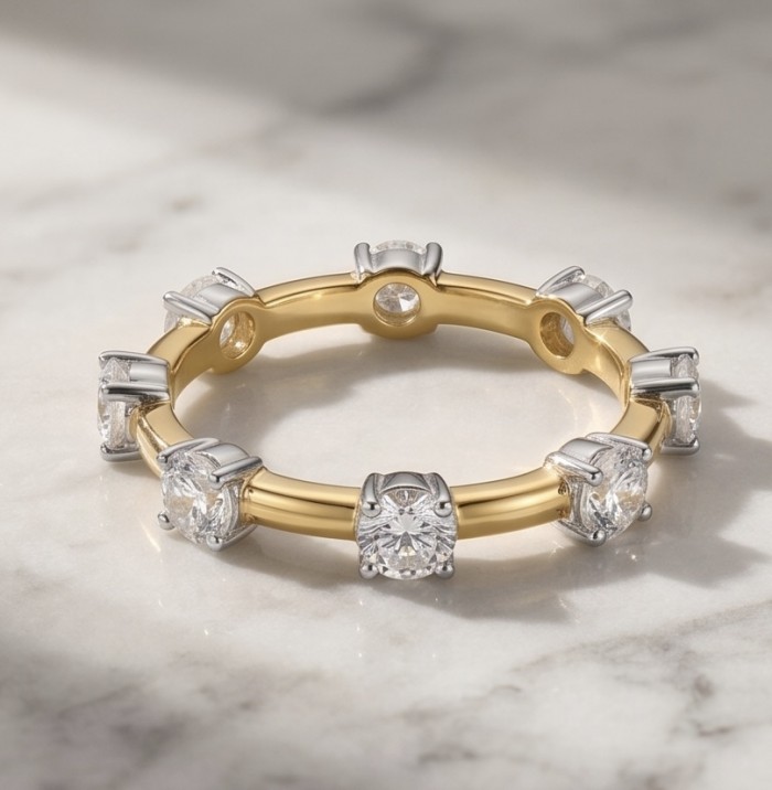 Natural 2.5 carat Topaz .925 Sterling Silver dipped in 14K Gold handmade Ring size 9 - Gold and silver ring with topaz stones, side view on marble surface.