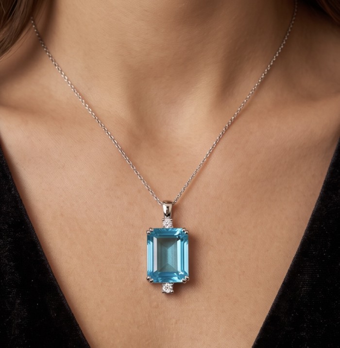 Angelina 4.9 carat authentic Aquamarine .925 Sterling Silver Handcrafted pendant - Necklace with aquamarine pendant worn on neck, front view.
