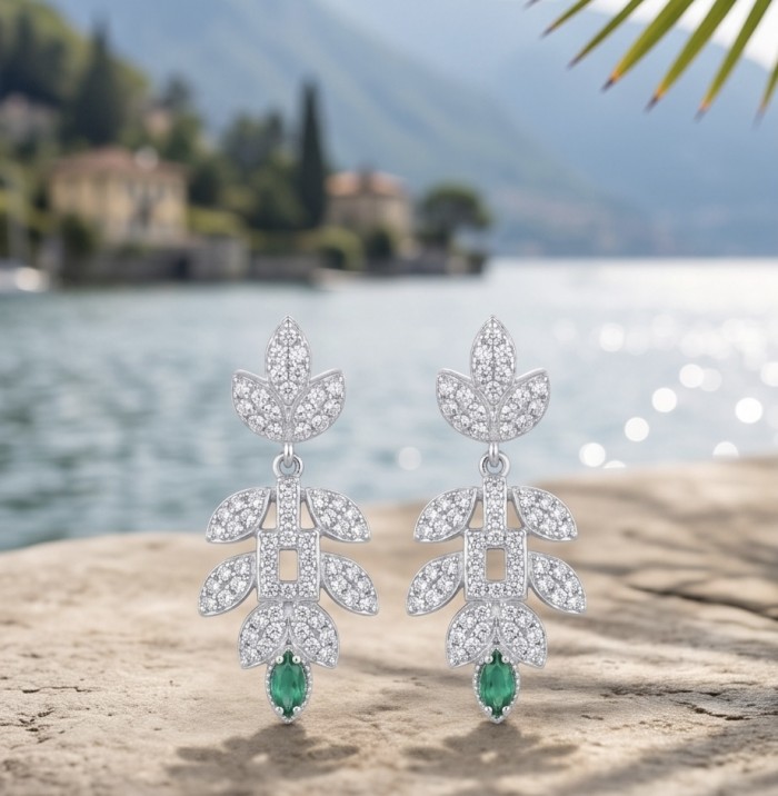 Precious 2.2 carat natural Colombian Emerald rhodium over .925 Sterling Silver earrings - Close-up of emerald and diamond earrings by a lake's edge.