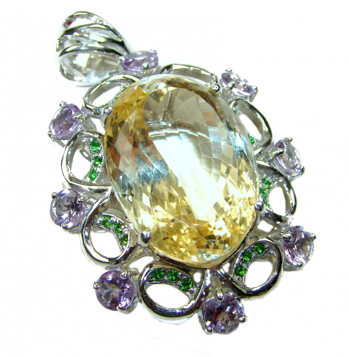 Luxurious Oval cut 32.3 carat Brazilian Citrine rhodium over .925 Sterling Silver handcrafted LARGE pendant - Close-up of oval cut citrine pendant with green and purple gemstones.