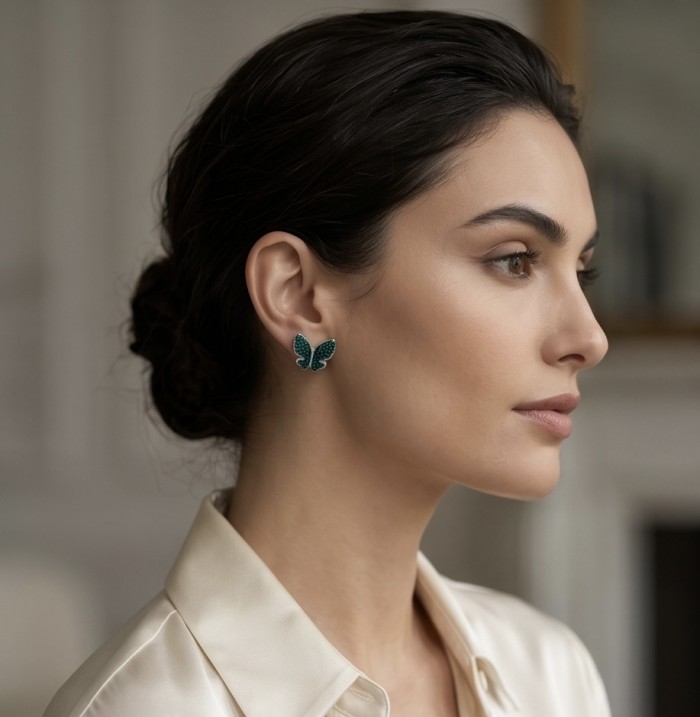 Incredible Butterflies genuine mystery setting 15.5 CARAT Emerald .925 Sterling Silver handcrafted Earrings - Side view of butterfly earring worn on ear, 15.5 carat E.