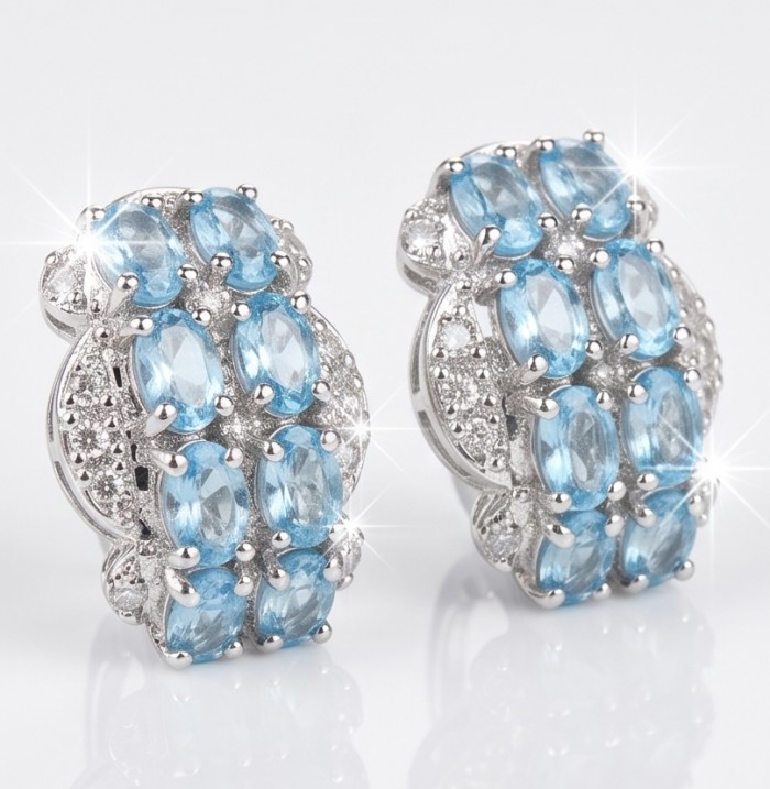 Angelina 9.9 carat authentic Swiss Blue Topaz .925 Sterling Silver Handcrafted Earrings - Blue topaz earrings front view, sterling silver setting, sparkling stones