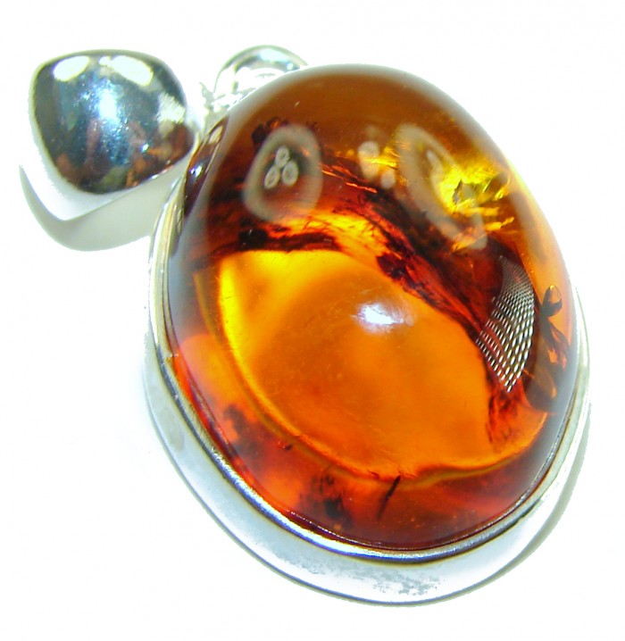 Prehistoric Authentic Baltic Amber .925 Sterling Silver beautifully handcrafted Pendant - Close-up of Baltic amber and silver pendant from above.