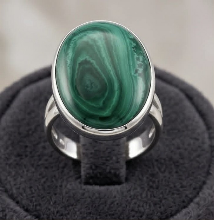 Green Passion 26.2 CARAT genuine Malachite from Utah .925 Sterling Silver handcrafted ring size 8 adjustable - Malachite ring stone close-up on display stand.