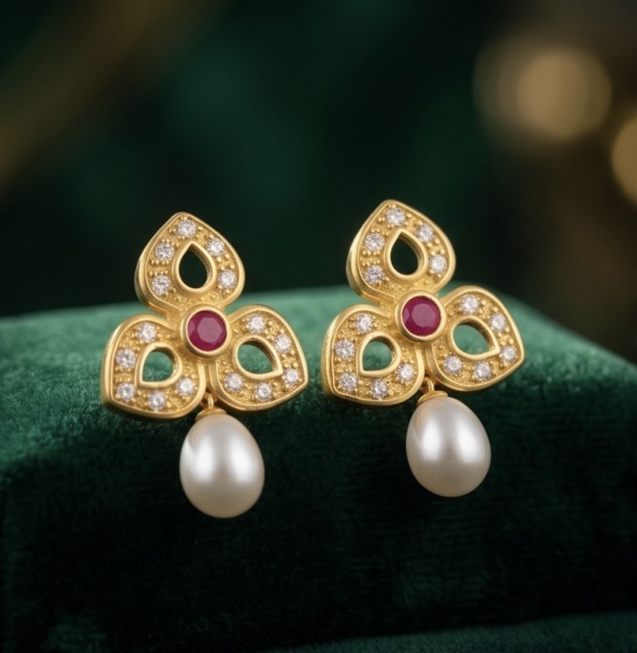 Magnificent Jewel 4.5 carat Ruby 14K Gold over .925 Sterling Silver handcrafted incredible earrings - Close-up of gold earrings with rubies and pearls on green velvet.