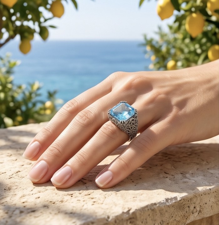 Poseidon 18.8 carat Swiss Blue Topaz .925 Sterling Silver dipped in rhodium handcrafted Large ring size 8 - Swiss Blue Topaz ring worn on hand, ocean background