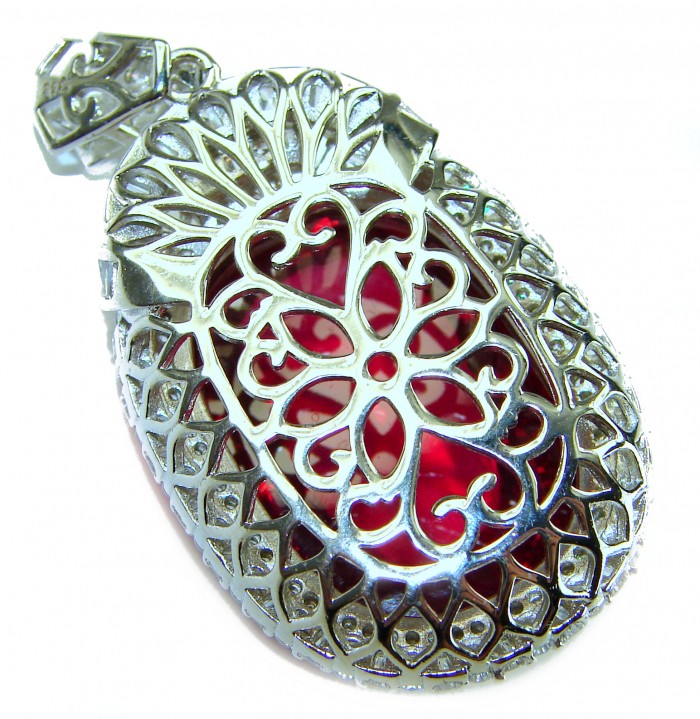 Rare finding! Deluxe 47.2 carat authentic Kashmir Ruby rhodium over .925 Sterling Silver handmade Statement Pendant - Close-up of Kashmir Ruby pendant with intricate silver lattice design.