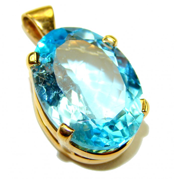 Atlantica oval cut 22.9 carat Swiss Blue Topaz 18K Gold over .925 Sterling Silver Handcrafted Pendant - Close-up of oval-cut Swiss Blue Topaz pendant in 18K gold setting.