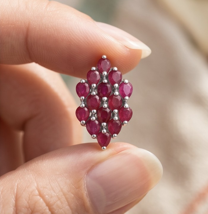 Giuseppina - Magnificent 10.8 carat authentic Ruby rhodium over .925 Sterling Silver handcrafted Statement earrings - Close-up of Giuseppina 10.8 ct ruby jewelry held between fingers.