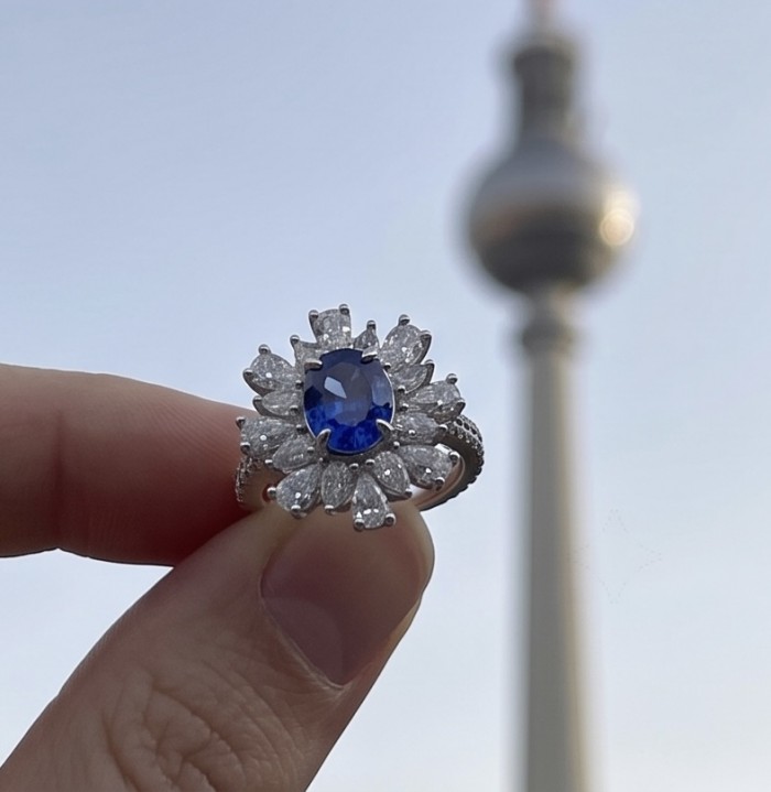 Julietta floral design 4.5 carat Sapphire .925 Sterling Silver handmade Statement ring size 6 1/4 - Close-up of Julietta floral sapphire ring held against blurred background