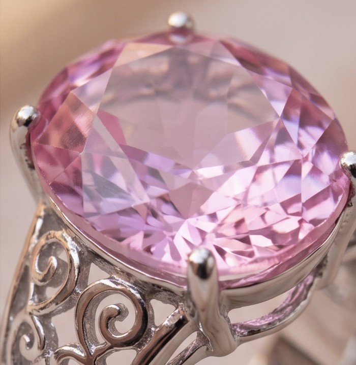 Anastasia 12.2 carat Pink Sapphire .925 Sterling Silver dipped in Rhodium Handcrafted Statement Ring size 8 - Pink sapphire stone close-up with ornate silver setting detail.