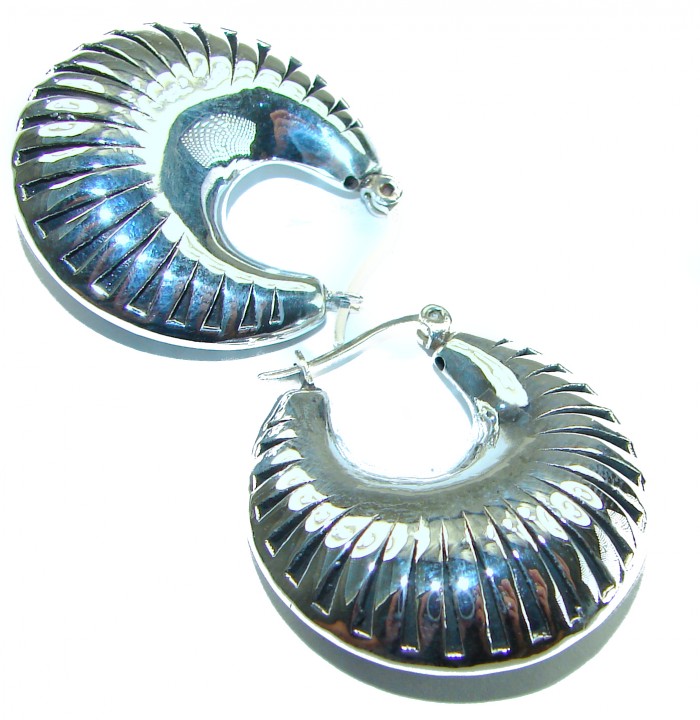 Highly Polished Fancy Modern design .925 Sterling Silver Italy made Earrings - Close-up of polished sterling silver earrings with a modern design.
