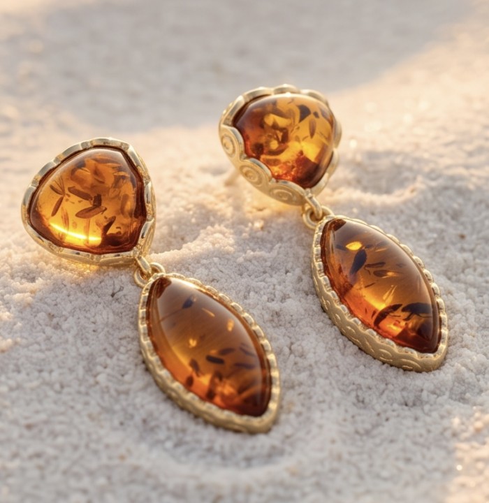 Golden Honey Drops authentic Baltic Amber 14K Gold over .925 Sterling Silver earrings - Amber earrings on sand, front view, 14K gold detailing.