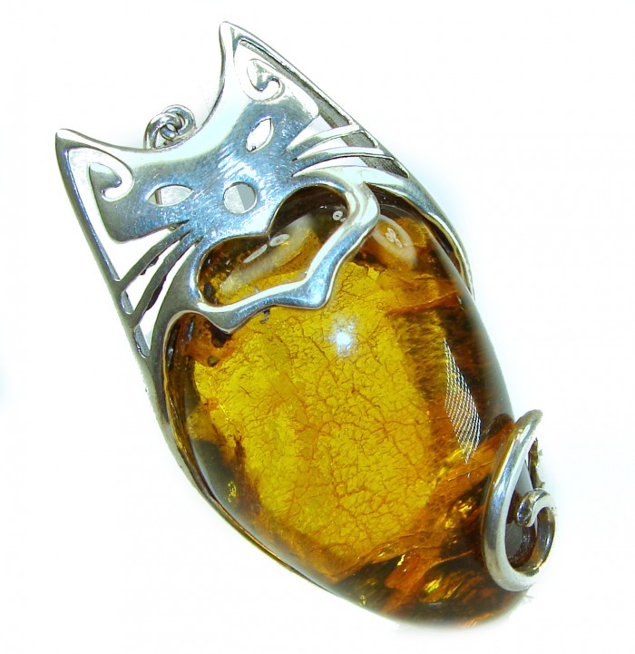 Tomcat 30.9 grams Prehistoric Authentic Baltic Amber .925 Sterling Silver beautifully handcrafted Large Pendant - Cat-shaped pendant with amber stone, top view, silver detailing.