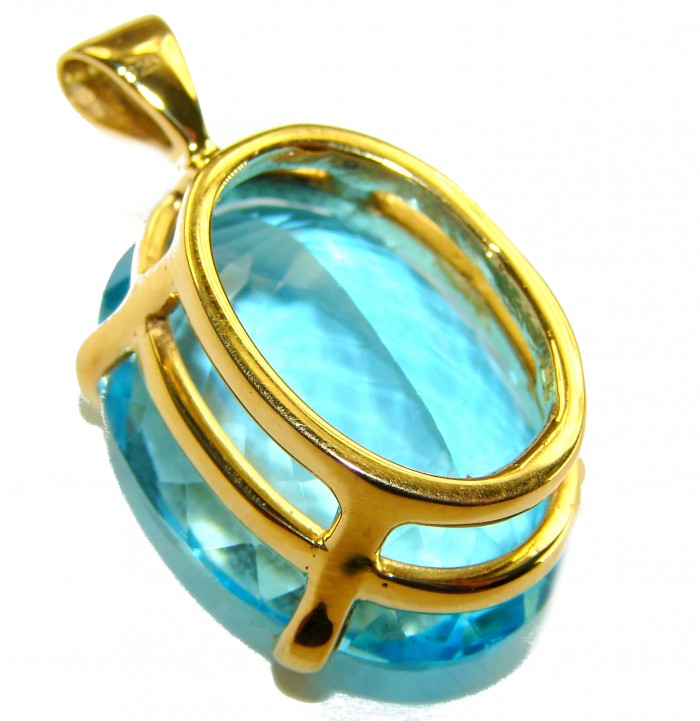 Atlantica oval cut 25.9 carat Swiss Blue Topaz 18K Gold over .925 Sterling Silver Handcrafted Pendant - Close-up of oval Swiss Blue Topaz pendant in 18K gold setting.