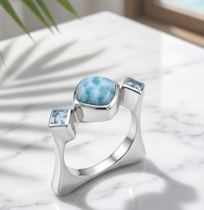 Caribbean Beauty 4.5 carat Genuine Blue Larimar .925 Sterling Silver handmade ring size 8 1/4 - Side view of silver ring with blue Larimar and square stones on marble surface.