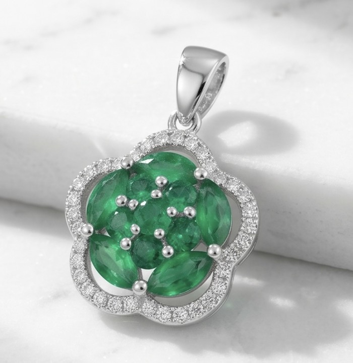 Authentic 4.5 CARAT Chrome Diopside .925 Sterling Silver Pendant - Chrome Diopside pendant stone close-up on marble background