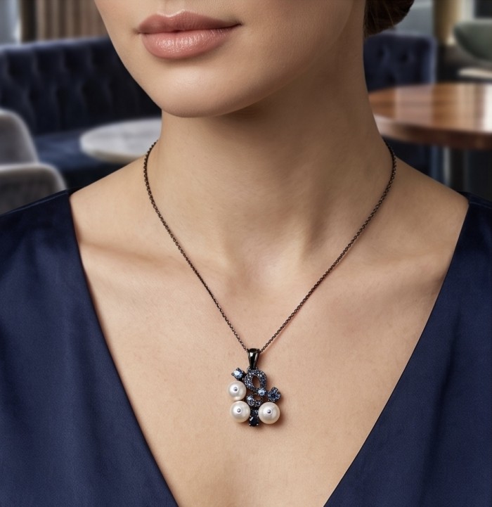 Tiffany - 7.8 carat Pearl Tanzanite Black RHODIUM over .925 Sterling Silver Handcrafted pendant - Necklace with pearls and tanzanite worn on neck, close-up view.