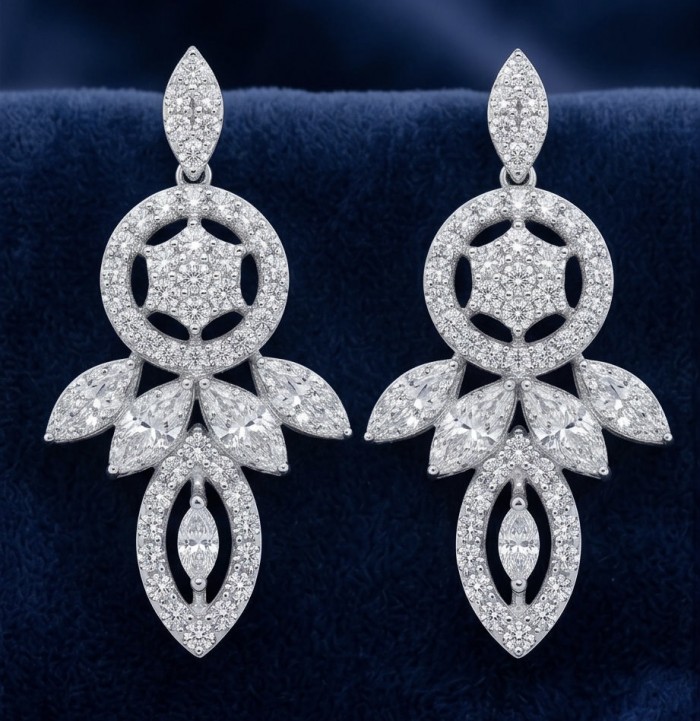 Waves 0.6 carat authentic White Topaz .925 Sterling Silver Handcrafted Earrings - Close-up of Waves white topaz earrings on blue velvet background.