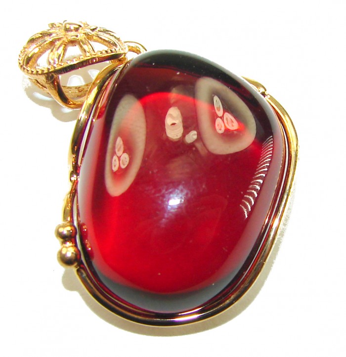 Prehistoric cognac Authentic Baltic Amber 14K Gold over.925 Sterling Silver beautifully handcrafted Pendant - Close-up of cognac Baltic amber pendant in 14K gold setting.
