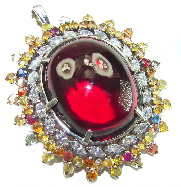 Oversized! Rare finding! Deluxe 67.2 carat authentic Red Topaz rhodium over .925 Sterling Silver handmade Statement Pendant - Close-up of deluxe 67.2 carat red gemstone pendant with multicolor accents.