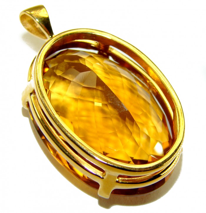 Luxury genuine 39.7 CARAT oval cut Champagne Topaz .925 Sterling Silver dipped in 22K Gold handmade Pendant - Close-up of oval-cut Champagne Topaz pendant with gold setting.