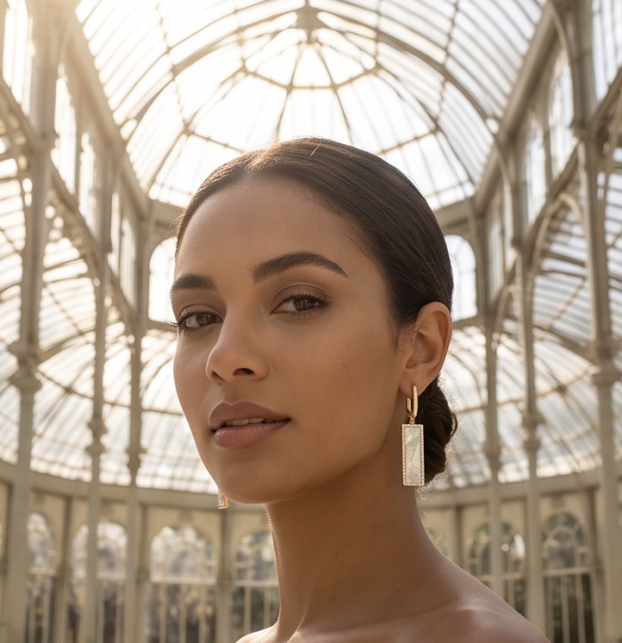 Luxurious Genuine Blister Pearl 0.4 CARAT lab grown Diamond 18K Gold over .925 Sterling Silver handcrafted Statement Earrings - Model wearing blister pearl earrings in a glass-roofed building.