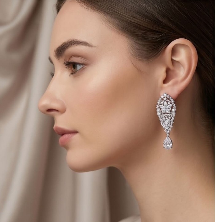 Veronica - Precious 35.5 carta White Topaz rhodium over .925 Sterling Silver .925 Sterling Silver Statement earrings - Side view of woman wearing Veronica white topaz earrings.