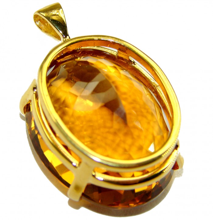 Luxury genuine 39.7 CARAT oval cut Champagne Topaz .925 Sterling Silver dipped in 22K Gold handmade Pendant - Close-up of luxury 39.7 carat oval cut Champagne Topaz pendant in gold setting.