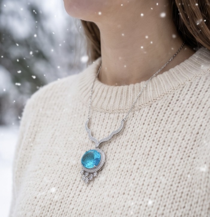 A Wild Ocean genuine 27.4 carat Paraiba Tourmaline .925 Sterling Silver handmade Statement necklace - Necklace worn on neck with large blue Paraiba Tourmaline in winter setting.