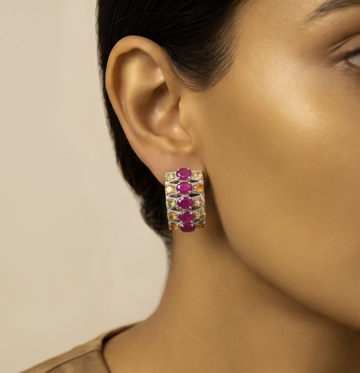 Valentina 18.2 carat Mozambique Ruby multicolor Sapphire .925 Sterling Silver dipped in rhodium Statement handcrafted earrings - Side view of Valentina earrings worn, featuring rubies and sapphires.