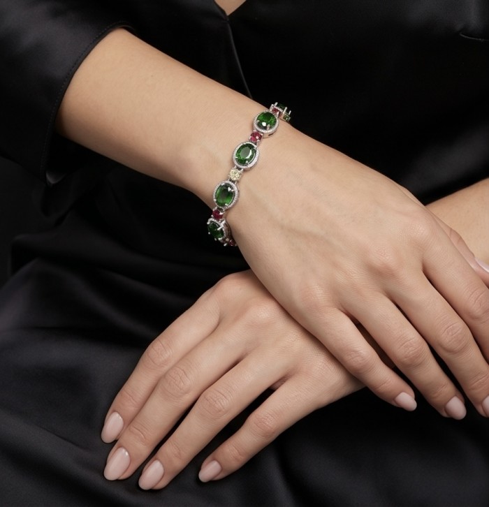 Authentic 17.9 carat Chrome Diopside .925 Sterling Silver handcrafted Bracelet - Bracelet worn on wrist showcasing green stones in sterling silver.