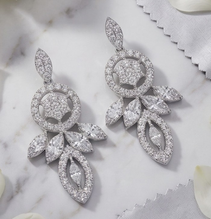 Waves 0.6 carat authentic White Topaz .925 Sterling Silver Handcrafted Earrings - Elegant white topaz earrings, front view on marble surface.
