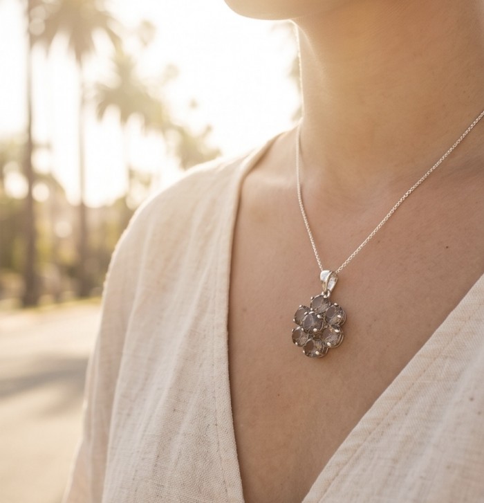 Penelope - 15.5 carat Smoky Topaz rhodium over .925 Sterling Silver handmade Pendant - Smoky Topaz pendant on neckline, front view in sunlight