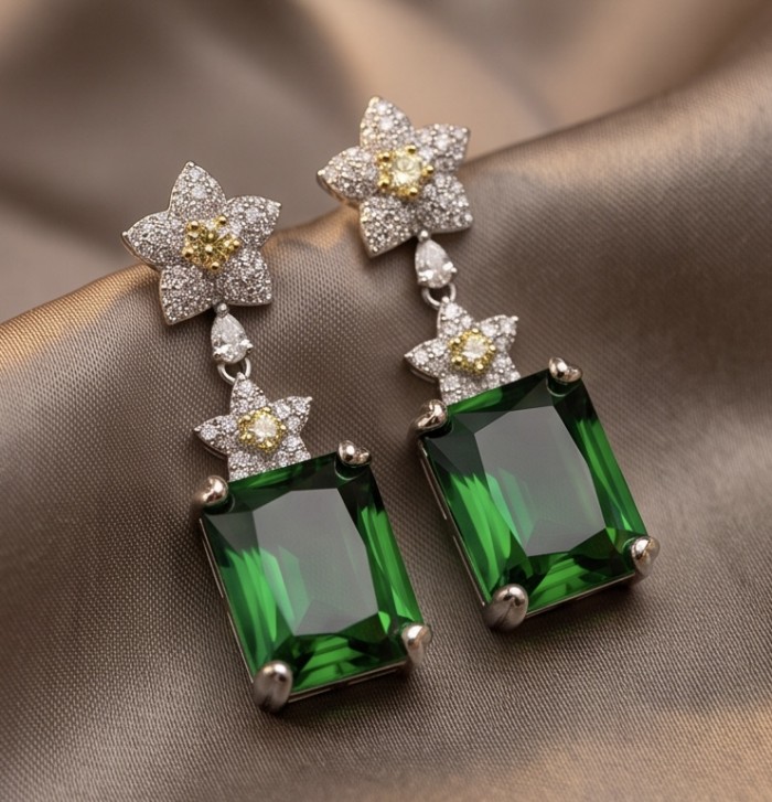 Tiffany - Authentic 14.8 CARAT Siberian Chrome Diopside rhodium over .925 Sterling Silver handcrafted earrings - Elegant earrings with green stones and diamond star accents, close-up view.