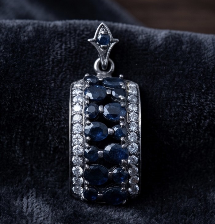Vintage Beauty 9.7 carat Mozambique Sapphire Black Rhodium over .925 Sterling Silver handcrafted pendant - Close-up of vintage black rhodium sapphire pendant on velvet背景
