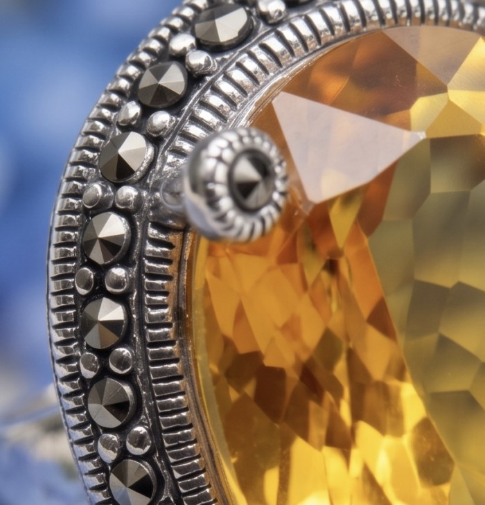 Authentic oval cut 31.2 carat Golden Topaz rhodium over .925 Sterling Silver ring s. 8 - Close-up of Golden Topaz ring with detailed metalwork.