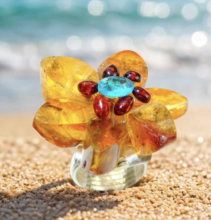 Magical Fern Flower Natural Baltic Amber 4.9 carat Swiss Blue Topaz .925 Sterling Silver handmade Large STATEMENT ring; s. 7 adjustable - Flower-shaped amber ring with blue and red gemstones on sandy backdrop