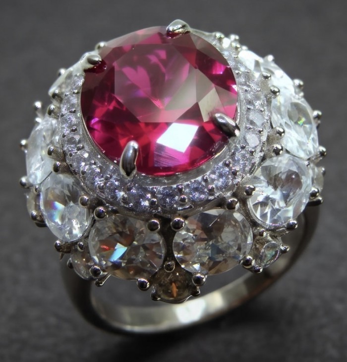 Scarlett 14.8 ctw Mozambique Ruby rhodium over .925 Sterling Silver handcrafted Statement Ring size 6 1/4 - Close-up of Scarlett Mozambique Ruby ring with clear stone accents