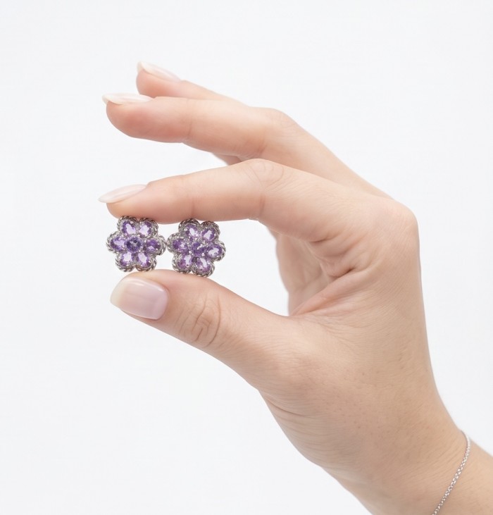 Lavender Beauty authentic 9.2 carat Amethyst .925 Sterling Silver dipped in rhodium handcrafted earrings - Close-up of Lavender Beauty amethyst earrings held between fingers.
