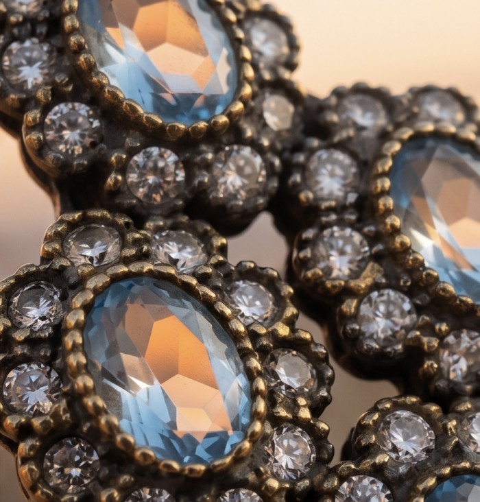 Victorian Style oval cut 4.5 carat London Blue Topaz .925 Sterling Silver handmade Pendant - Close-up of Victorian-style London Blue Topaz jewelry with sparkling stones.