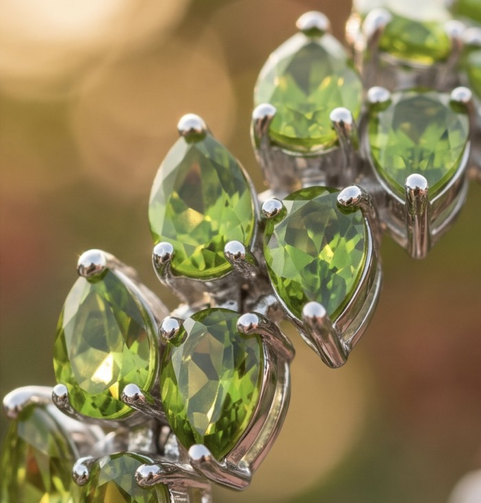 Vittoria Natural 44.8 carat Brazilian Peridot Rhodium over .925 Sterling Silver handmade Statement Bracelet - Close-up of Vittoria Brazilian Peridot stones in rhodium setting.