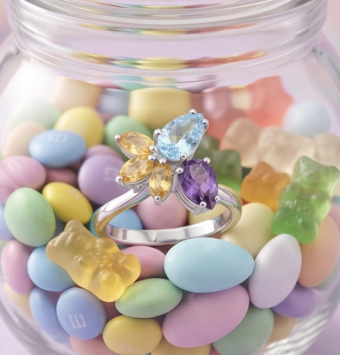 Pacifica 7.8 carat Swiss Blue Topaz .925 Sterling Silver handcrafted ring size 9 - Sterling silver ring with topaz close-up, surrounded by colorful candies.