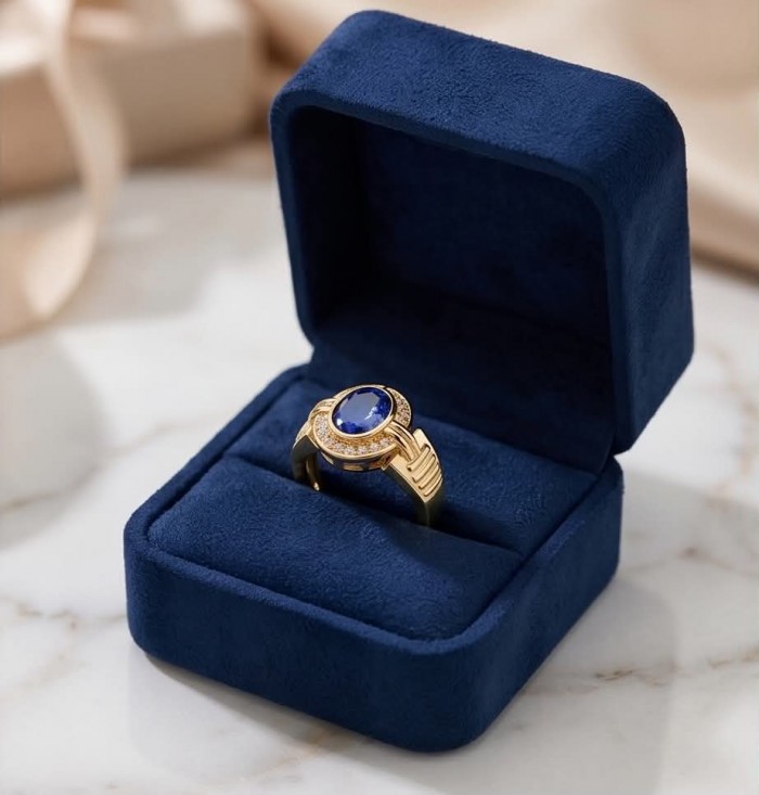 Born to Glam 4.1 carat natural Tanzanite .925 Sterling Silver dipped in 18K Gold Perfectly handcrafted Ring s. 7 - Ring in box with blue stone close-up, gold and silver details.