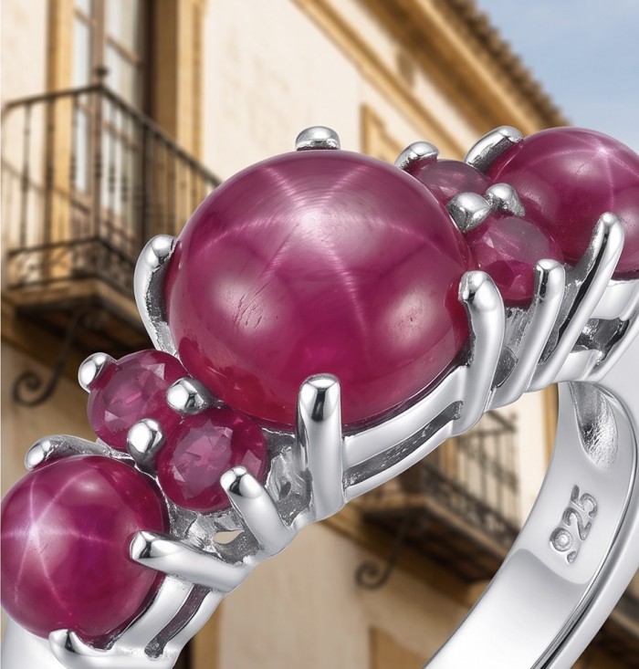 Born to Glam authentic 4.2 carat Ruby rhodium over .925 Silver handcrafted Ring s. 7 1/2 - Close-up of ruby stones on silver ring with "925" marking.